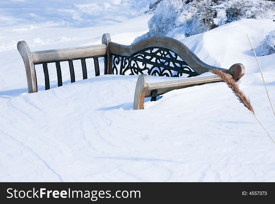 Bench covered with deep snow in winter. Bench covered with deep snow in winter