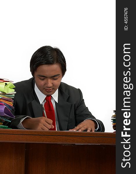 A man sitting behind his office desk. A man sitting behind his office desk