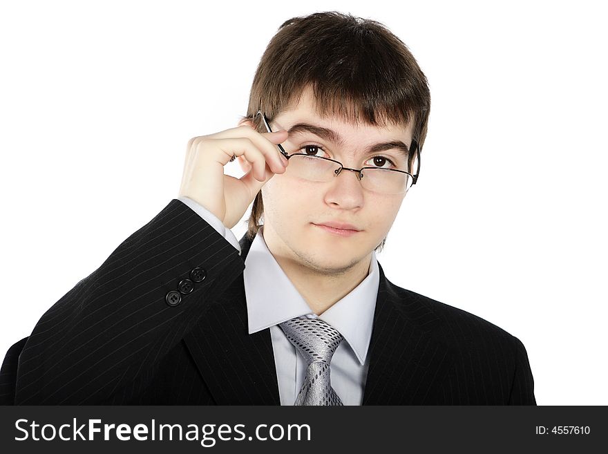 Portrait of a young serious businessman on a white background