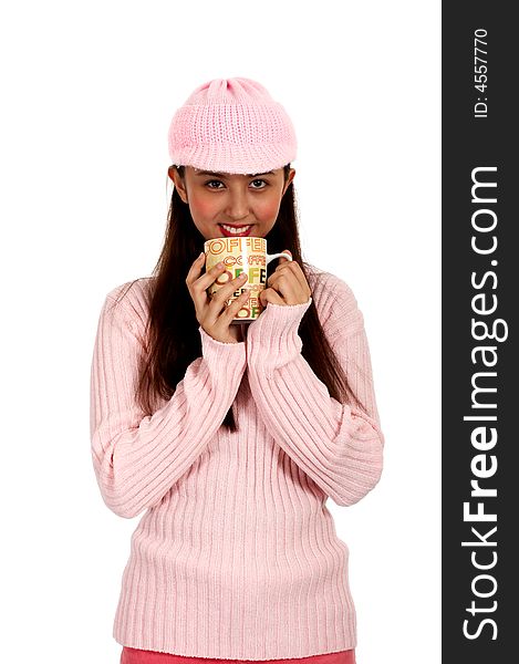 teenager in winter clothes holding a cup of coffee
