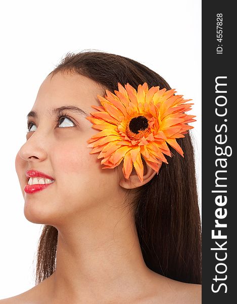 Young beautiful lady with flower looking up