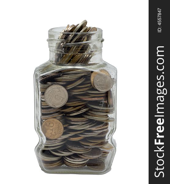 Glass bank with metal coins on white background. Glass bank with metal coins on white background.