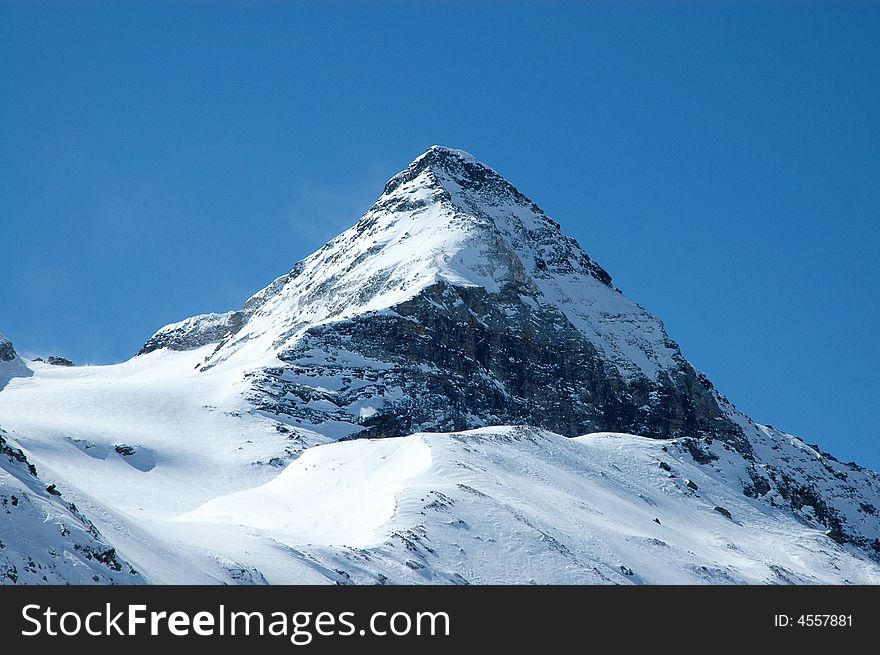 Snowy mountain on sunny winter day in Italian Alps. Snowy mountain on sunny winter day in Italian Alps