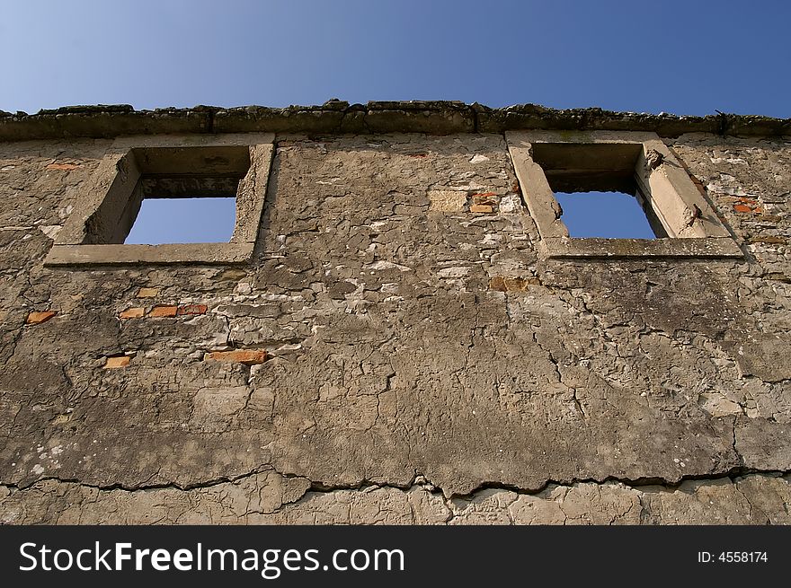 Ruins of an old house with the blue sky. Ruins of an old house with the blue sky.