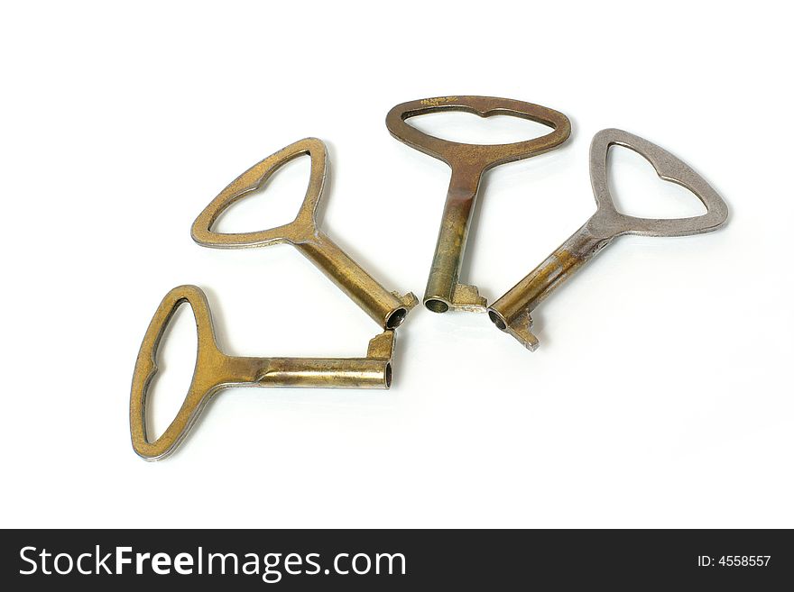 Four old keys on a white background. Four old keys on a white background