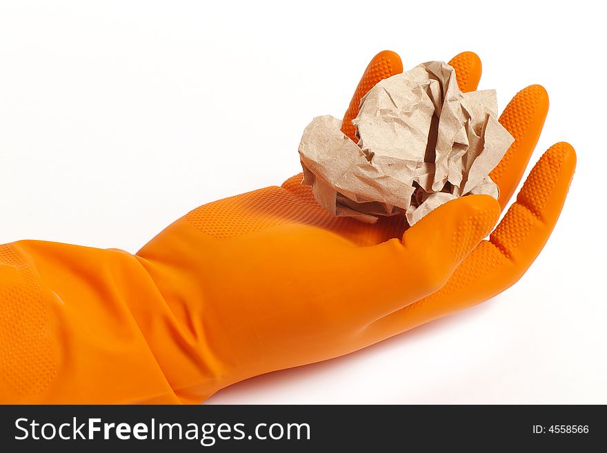 Arm in an orange glove and paper. Arm in an orange glove and paper