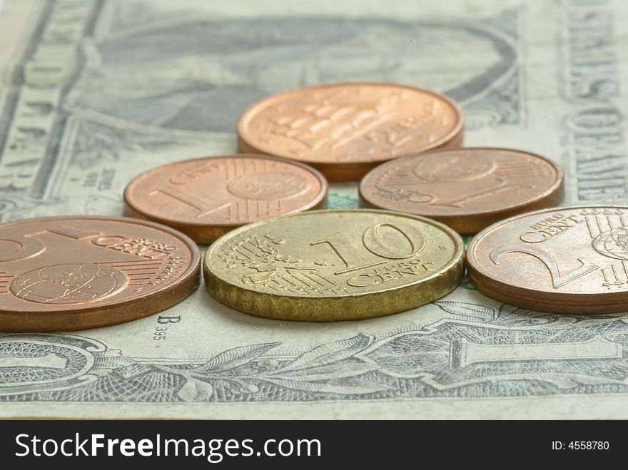 Money - euro coins on one dollar banknote. Money - euro coins on one dollar banknote