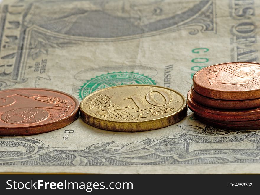 Money -  euro coins on one dollar banknote. Money -  euro coins on one dollar banknote