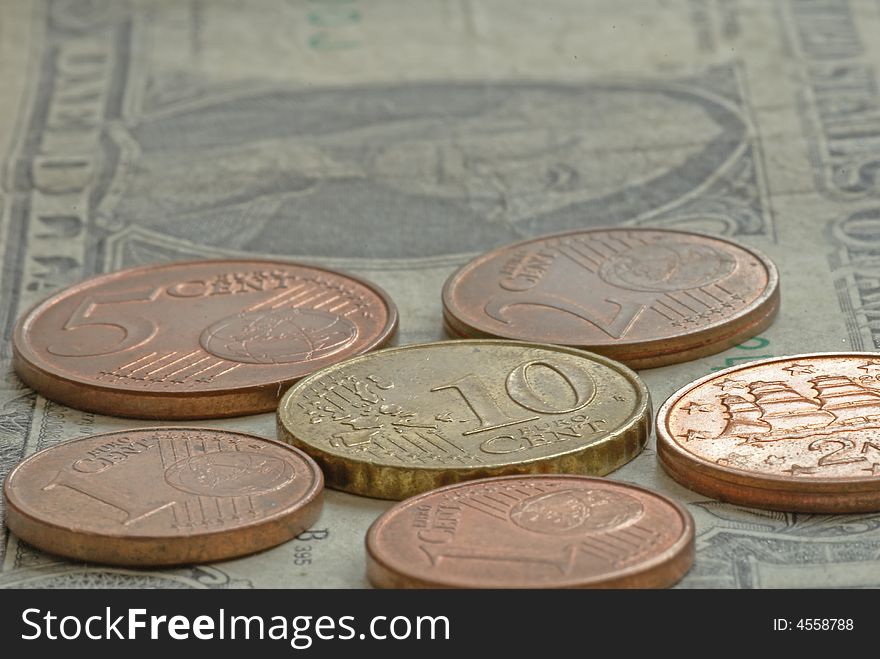 Money -  euro coins on one dollar banknote. Money -  euro coins on one dollar banknote