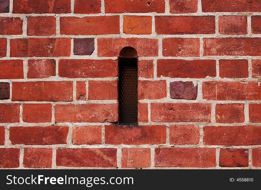 Brick wall with small window