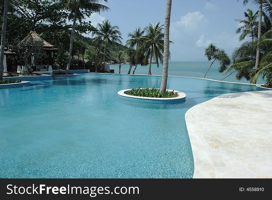 Tropical hotel with pool.