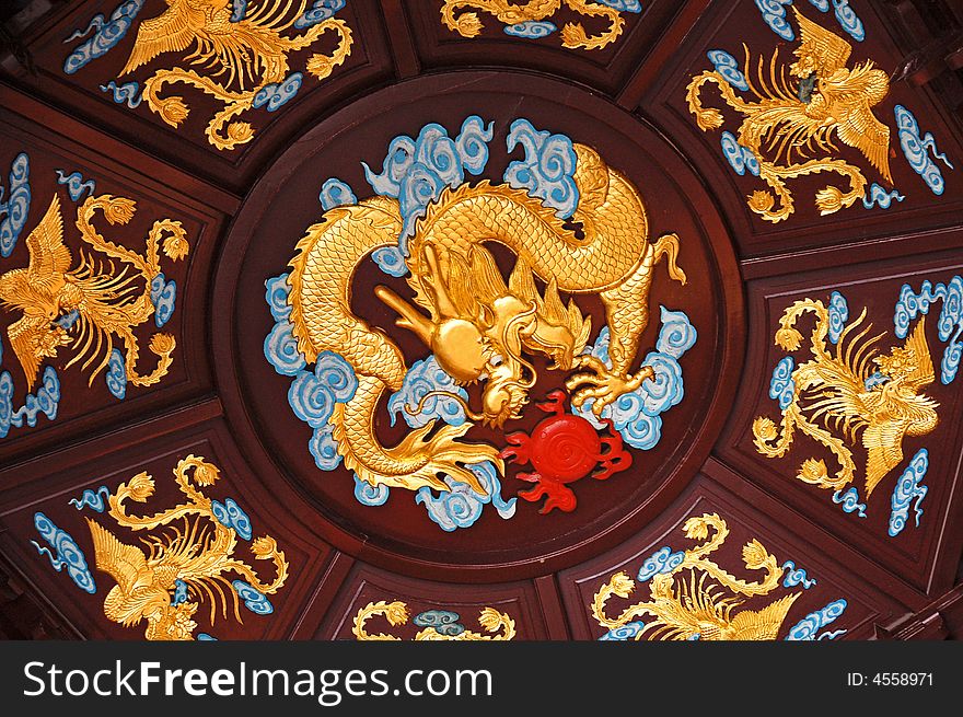 Chinese dragon crowded by phenixes. Chinese dragon crowded by phenixes