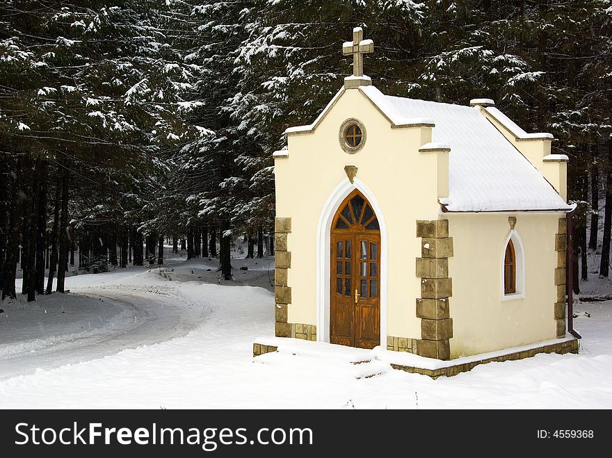 Small chapel in a snow-covered wood. Small chapel in a snow-covered wood