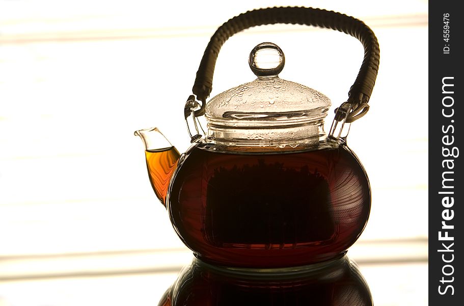 Teapot on the reflected background