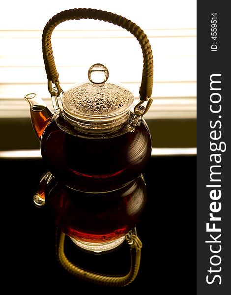 Teapot on the reflected background