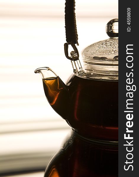 Teapot on the reflected background