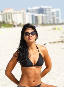 Woman With Sunglasses On The Beach Stock Photo