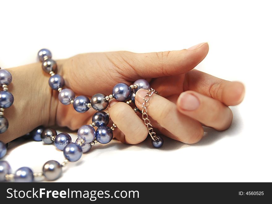 Hand with pearl beads, isolated. Hand with pearl beads, isolated