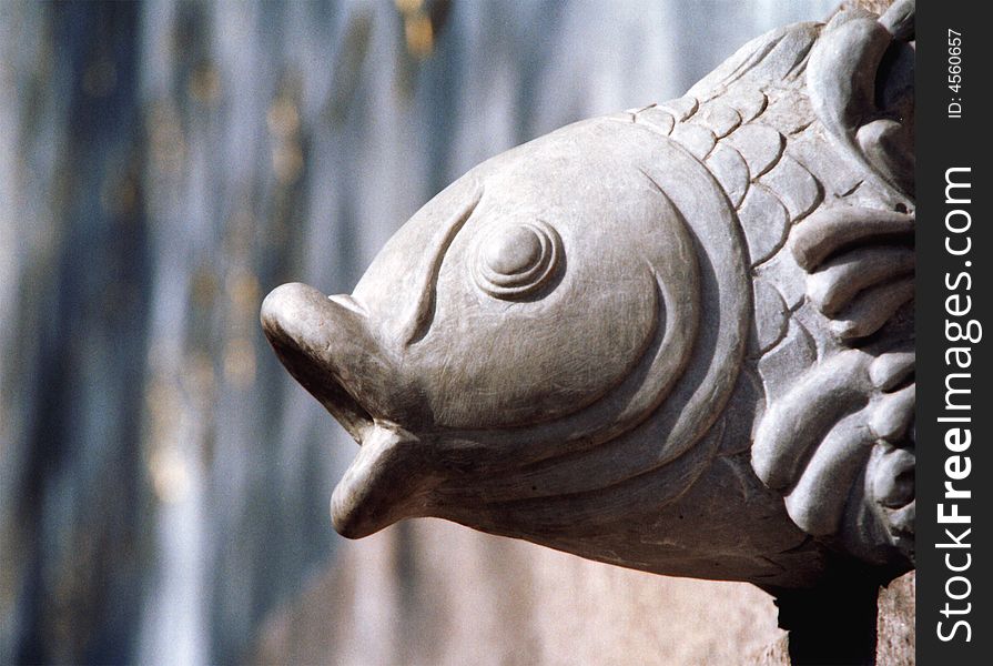 A fish sculpture on wall in Chinese temple.