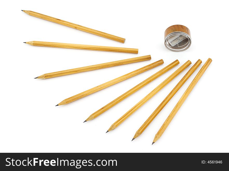 Isolated photo of sharpener and several pencils. Isolated photo of sharpener and several pencils