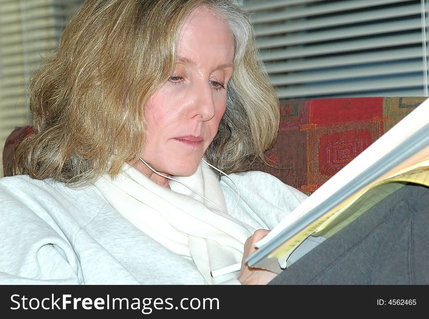 Businesswoman working on reports in her office.