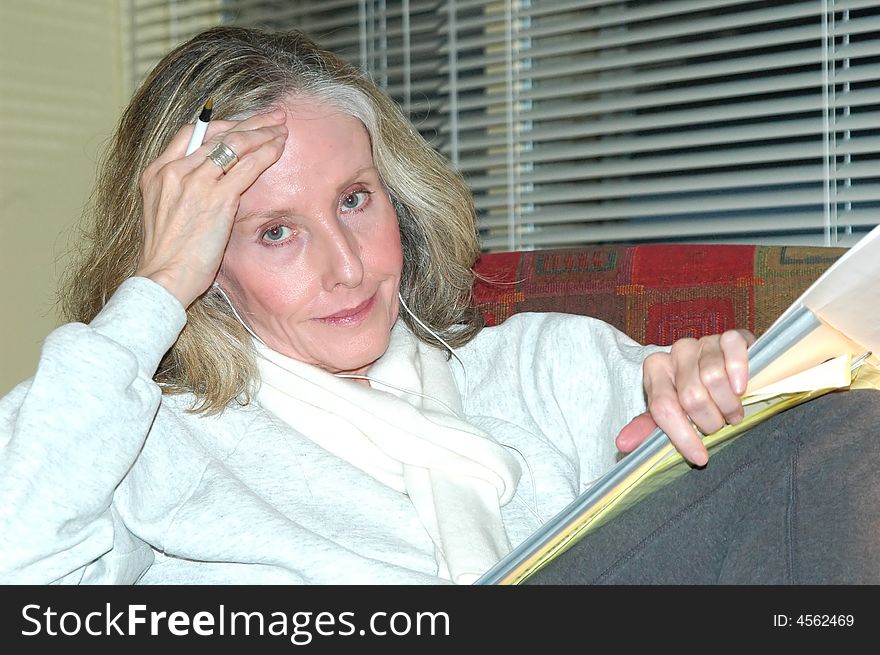 Businesswoman working on reports in her office.