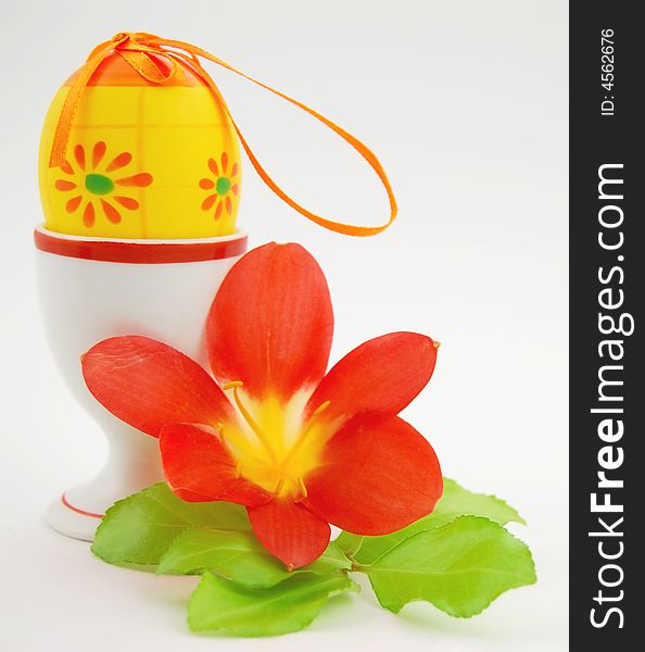 Easter egg and flower with foliage on white background. Easter egg and flower with foliage on white background