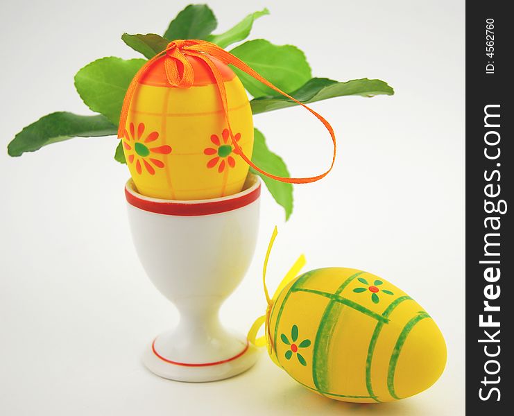Easter eggs and foliage on white background. Easter eggs and foliage on white background