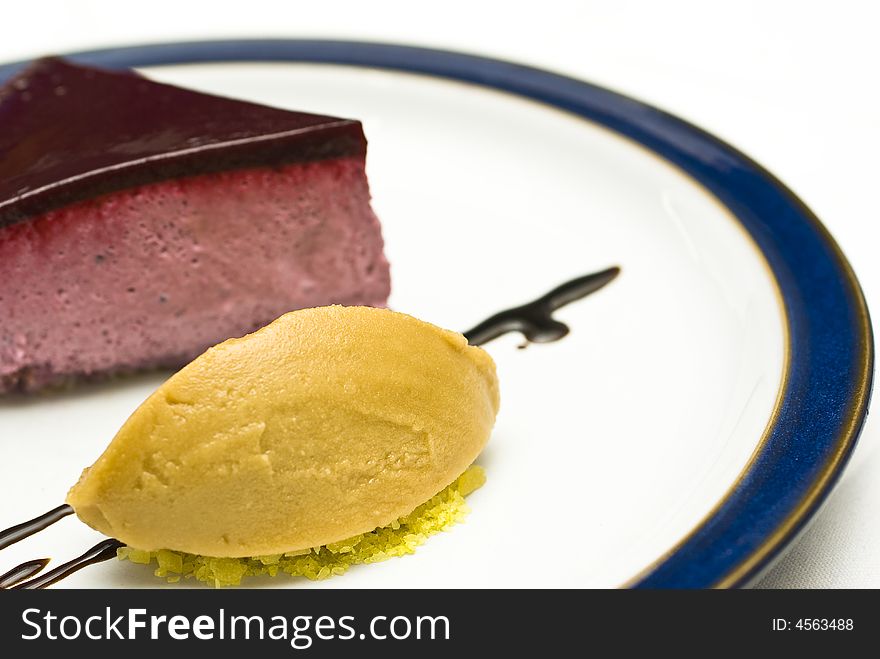 Cool high key shot of a black currant mousse with liqorice jelly and sorbet. Cool high key shot of a black currant mousse with liqorice jelly and sorbet
