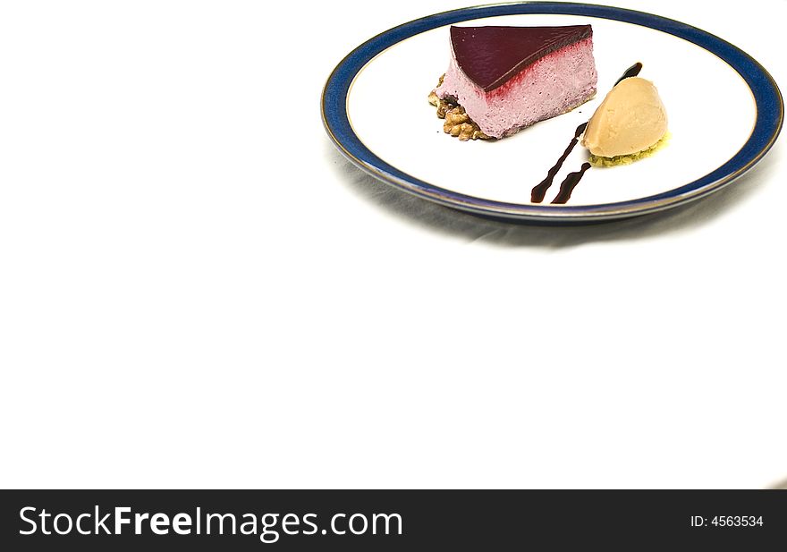 Cool high key shot of a black currant mousse with liqorice jelly and sorbet. Cool high key shot of a black currant mousse with liqorice jelly and sorbet