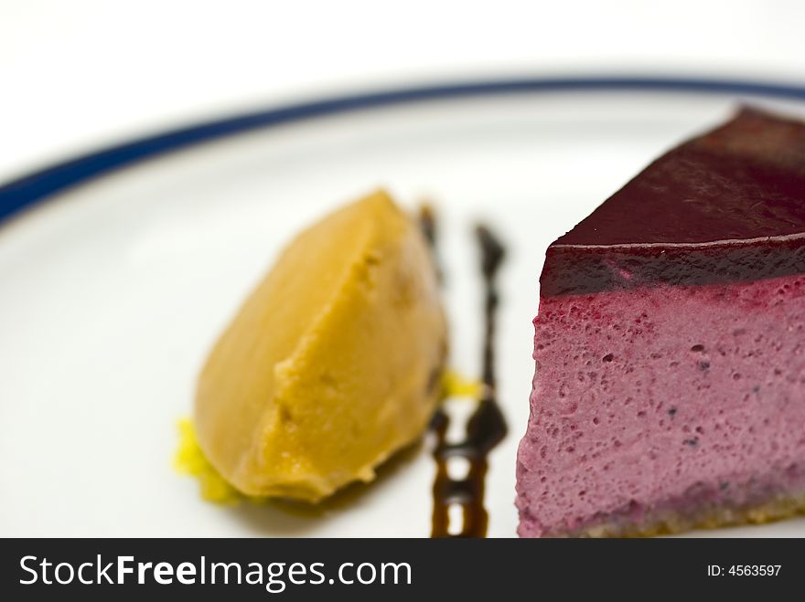 Cool high key macro crop shot of a black currant mousse with liqorice jelly and sorbet. Cool high key macro crop shot of a black currant mousse with liqorice jelly and sorbet