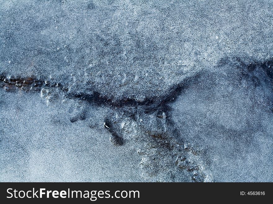 Clear spring ice on a lake. A sequence of thawing, cracking, and freezing again have built wonderful patterns. Clear spring ice on a lake. A sequence of thawing, cracking, and freezing again have built wonderful patterns.