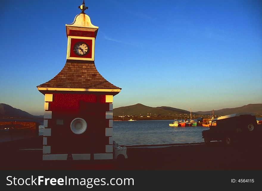 Small harbor with red clock tower at Valencia Island, Western Ireland