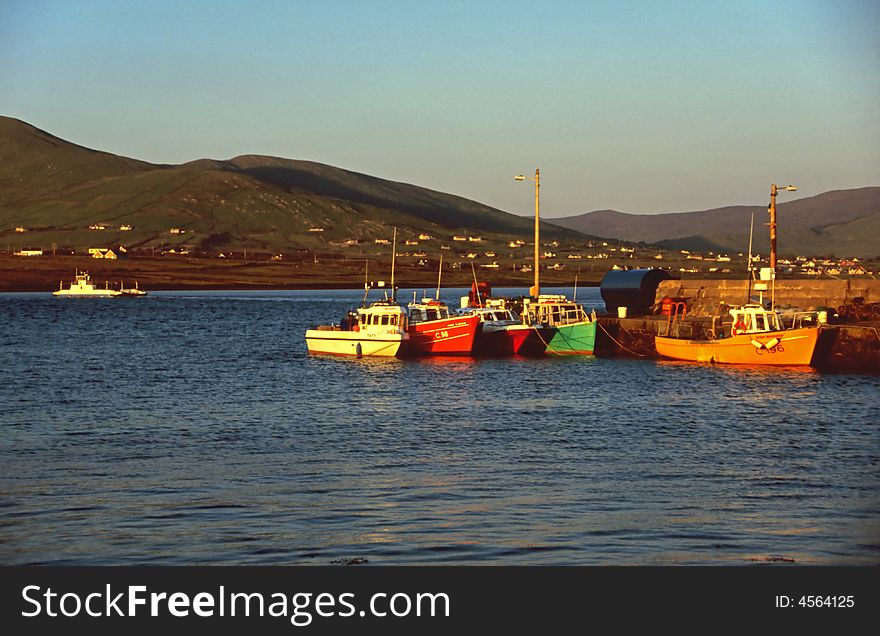 Colorful boats in the small harbor at Valencia Island, Western Ireland. Colorful boats in the small harbor at Valencia Island, Western Ireland