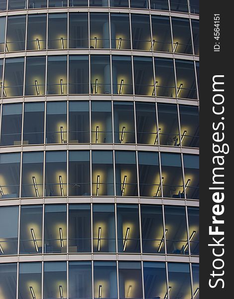 Illuminated windows of corporate office building. Illuminated windows of corporate office building.