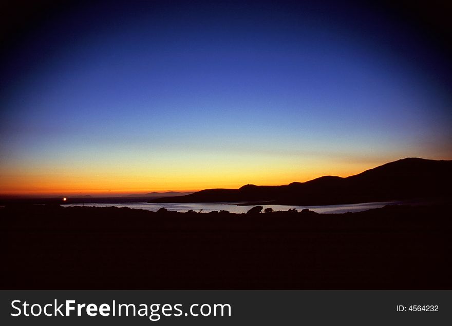 Last light at sea in the harbour of Portmaggee, Western Ireland