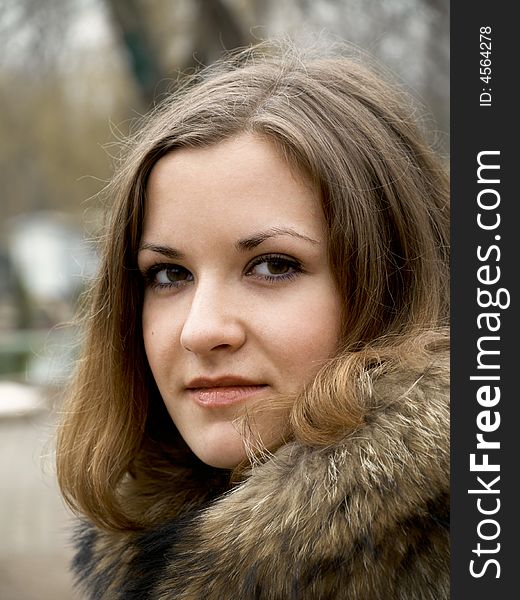 Beautiful girl in fur coat