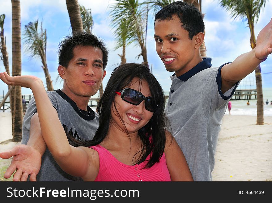 Three young asian at beach. Three young asian at beach