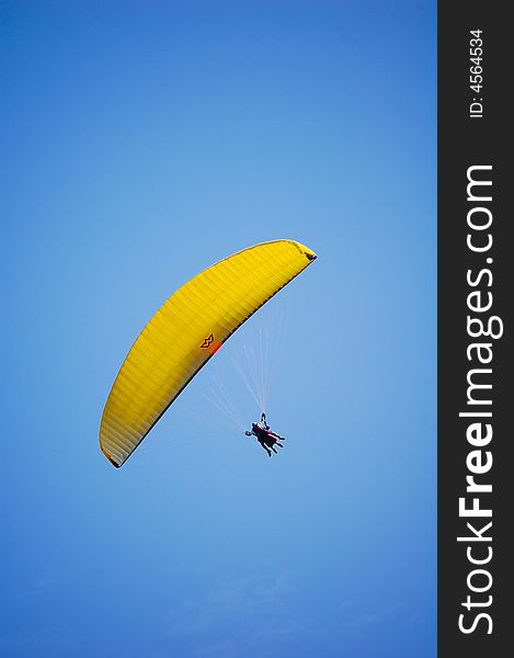Biplace Paraglider in the blue sky