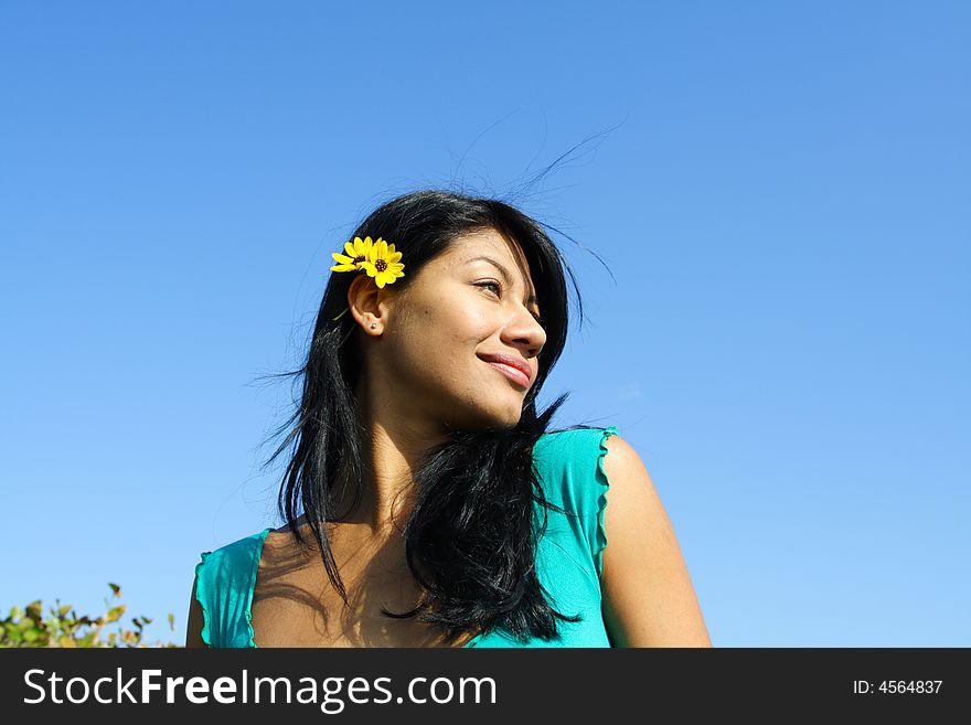 Womans head on a blue sky background. Womans head on a blue sky background