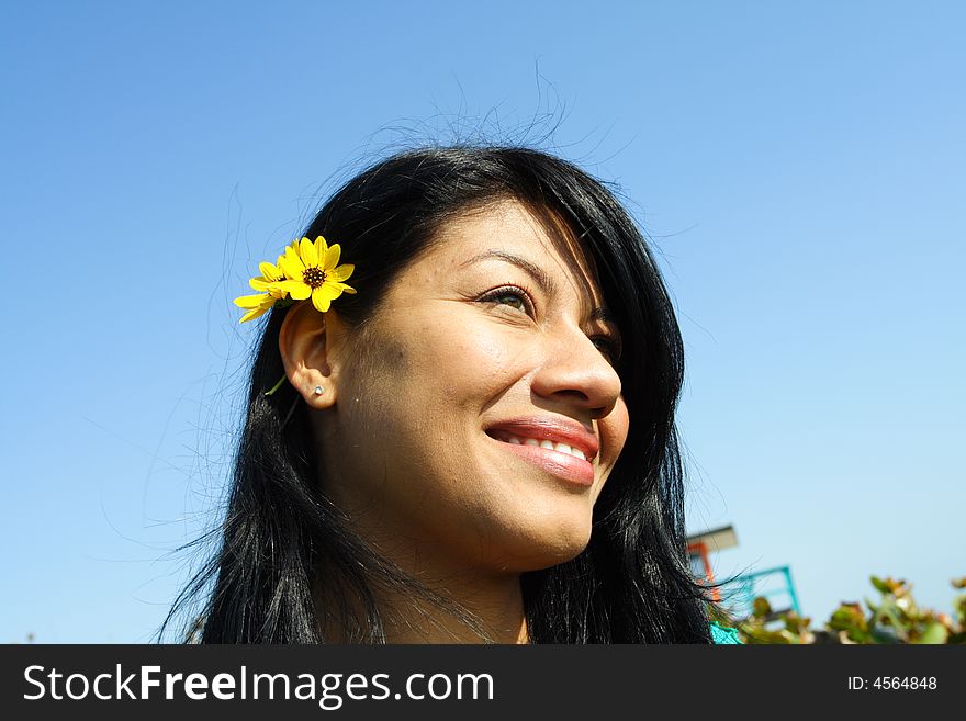Womans head on a blue sky background. Womans head on a blue sky background