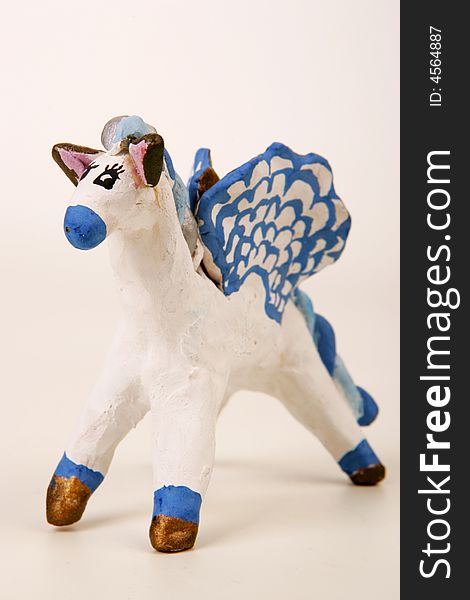 A painted clay figure of fairy winged horse. A painted clay figure of fairy winged horse