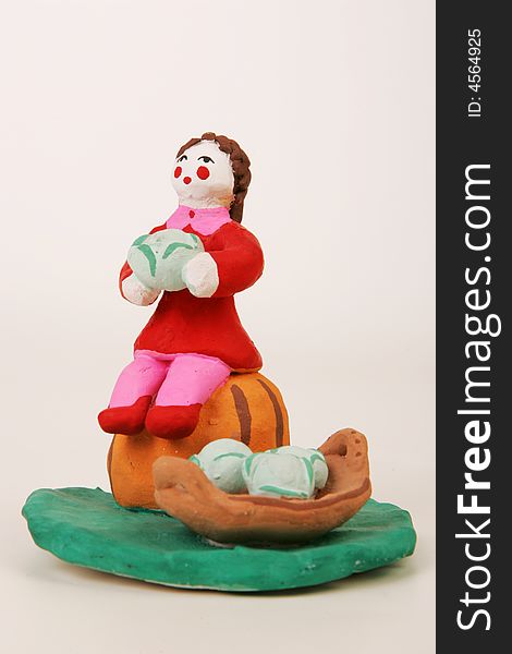 A terracotta statuette of f market trader. A terracotta statuette of f market trader