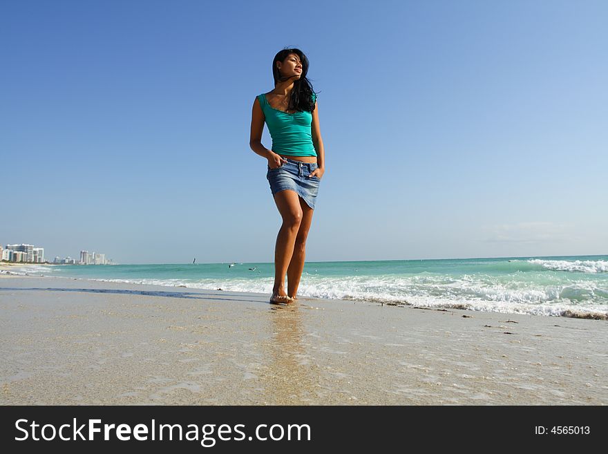 Woman dragging her toes in the sand. Woman dragging her toes in the sand.