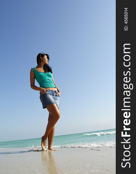 Woman Walking On The Beach