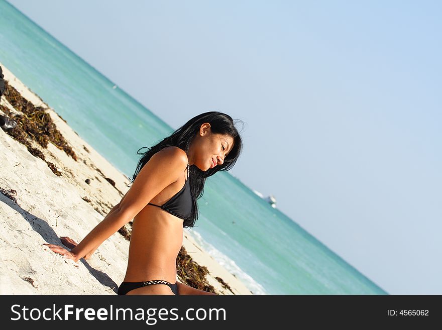 Woman Relaxing On The Beach