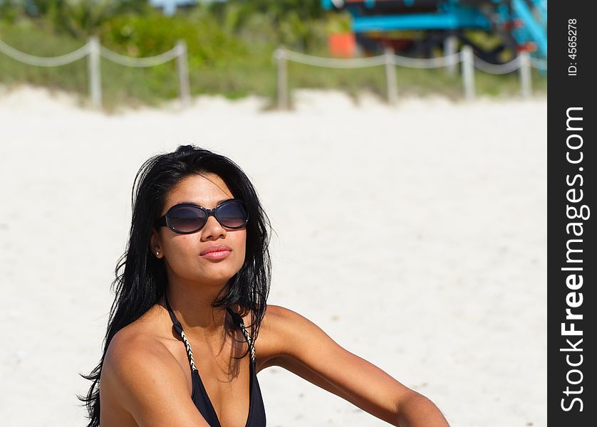 Woman With Sunglasses on the Beach