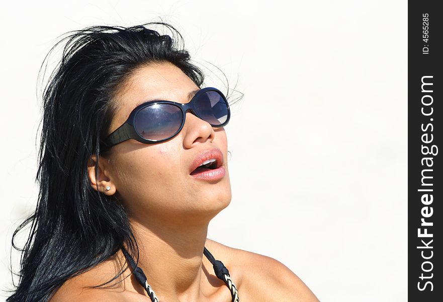 Woman With Sunglasses on the Beach