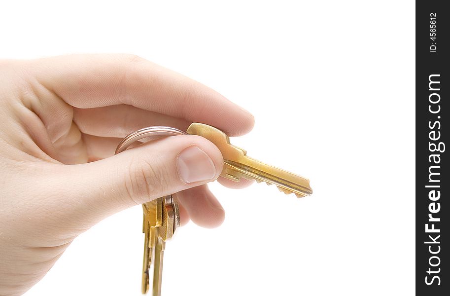 Human hand with keys on white