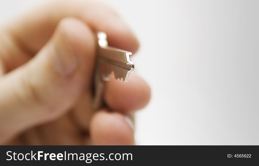 Human hand with keys on white